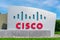 Cisco sign near Cisco headquarters campus in Silicon Valley. The red and blue logo depicts the two towers of the Golden Gate