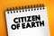 Citizen of Earth text on notepad, concept background