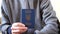 A citizen of Ukraine shows his biometric passport. Passport in the hands of a close-up.