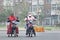 Citizens on e-bikes with mouth cap against smog, Beijing, China