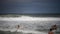 Citizens swim and sunbathe on the beach of Copacabana