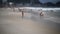 Citizens swim and sunbathe on the beach of Copacabana