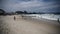 Citizens swim and sunbathe on the beach of Copacabana