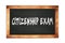 CITIZENSHIP  EXAM text written on wooden frame school blackboard