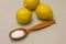 Citric acid in spoon on background of lemons