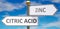 Citric acid and zinc as different choices in life - pictured as words Citric acid, zinc on road signs pointing at opposite ways to