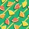 Citric fruits sliced in triangles pattern on yellow and green striped pattern