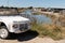 Citroen Mehari ancient beach car white convertible vehicle front of vendee coast in