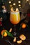 Citrus alcohol coctail with orange tangerine juce and grenadine in wineglass with slice of mandarine on top