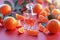 Citrus allure Red background complements perfume bottle adorned with Mandarin