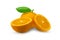 Citrus clementine or tangerine with leaf and half slices