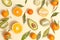 Citrus food on ligth-yellow background - assorted citrus fruits with mint leaves. Top view