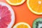 Citrus fruit background, slices of grapefruit, kiwi, mandarin. Summer template with copy space, empty place for text, bright