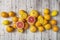 Citrus fruits in bulk on a white plank