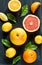 Citrus fruits (lemon, grapefruit and orange) on black chalkboard