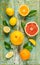 Citrus fruits (lemon, grapefruit and orange) on vintage wood