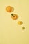 Citrus fruits are on a light yellow background. Kumquat, lemon, mandarin, orange are on a yellow background - Image