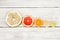 Citrus fruits slice on a wooden background, stacked pyramid. lemon, orange, lime, grapefruit, sweetie, pomelo, oroblanco