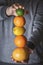 Citrus fruits stack hold in hand. Juicy summer fruits column