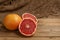 Citrus grapefruits on a wooden Board and an old grandma`s handkerchief, from Russia
