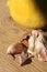 Citrus lemon and garlic fresh and healthy food products laying on wooden chop board ready to cook - food image close up with creat