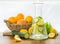 Citrus lemonade in glass jug on table