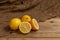 Citrus lemons on a wooden Board and an old grandma`s handkerchief, from Russia