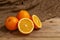 Citrus oranges on a wooden Board and an old grandma`s handkerchief, from Russia