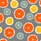 Citrus seamless pattern. Oranges, grapefruits and limes on gray background.