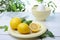 Citrus squeezer and fresh lemons being used to make lemonade