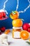 Citrus tangerine jam in a glass jar with a label for typing on a festive Christmas background with Christmas tree toys