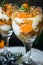 Citrus trifle with fresh tangerines. Christmas portioned dessert on the festive table