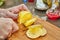 Citrus Zest: Skillful Chef Slices Fresh Lemon Circles on a Rustic Wooden Board in the Vibrant Kitchen