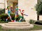 City abstract sculpture from multi-colored materials, depicting a family on a sports vacation. Located in Holon