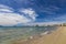 City beach of Vlora resort town, Albania. Summer sunny day. View of the city and the adriatic sea