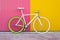 City bicycle fixed gear on yellow and red wall.