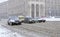 City after blizzard. Cars driving on a road of Hreshchatyk street heavily covered with snow