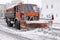 City after blizzard. Large plow truck removing snow from street of city. January 17, 2018. Kyiv, Ukraine