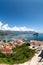 The city of Budva with the old town with fortified walls and red roofs. View from above, wide angle. Adriatic sea, Montenegro