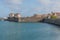 City buildings on the coastline under the blue sky in Peniche