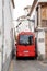 City bus in Granada driving through the extremely narrow streets of the old town of Granada