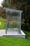 city bus stop. glass shelter with integrated wooden bench.