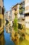 The city canal San Massimo runs among residential houses in the