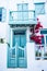 City center of mykonos, with his famous white houses, red flowers and blue doors. Greece