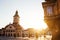 City central street with town council hall tower morning sunrise view, location Brasov, Transylvania, Romania. Famous travel