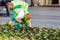 City communal service workers Planting flowers at flowerbed near city center, gardening and