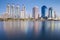 City condominium and office building with water reflection