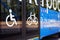 City electric bus, close-up of glass doors and side view with icons for disabled person, bicycle, elderly person