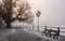 City embankment in foggy winter morning