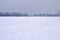 City Embankment under the snow, icy river.